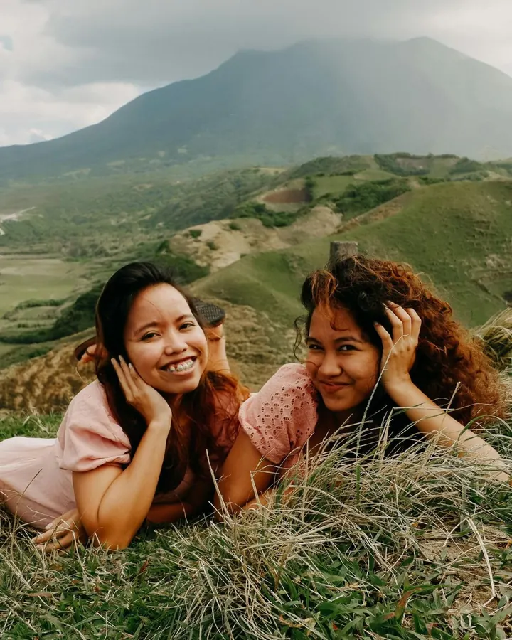 Two friends traveling in the mountains
