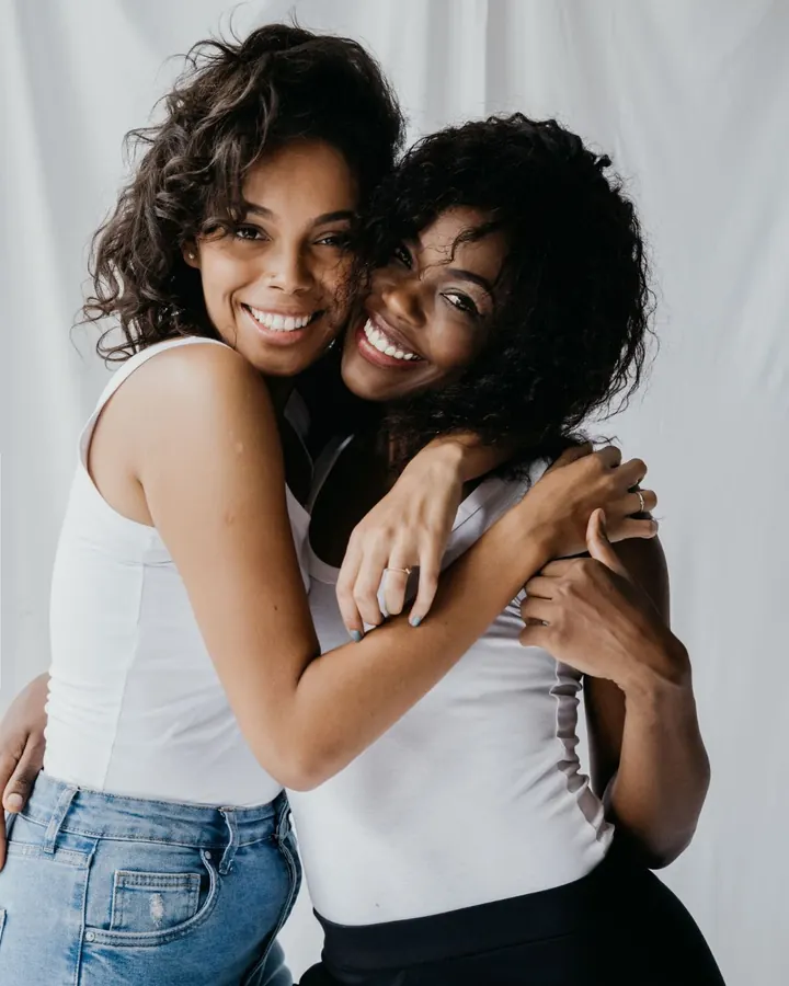 Best friends hugging and smiling